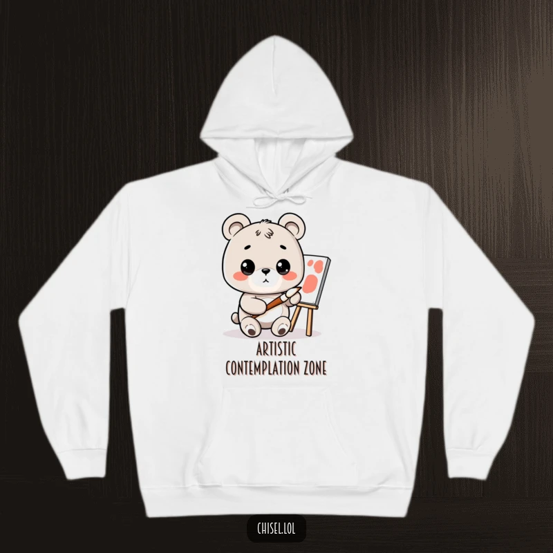 Funny Kawaii Bear Hoodie: A curious bear character with a tiny paintbrush, looking at a canvas, offering warmth and artistic fun.