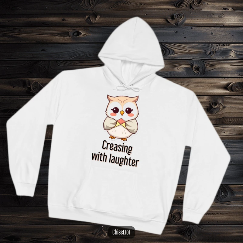 Funny Kawaii Owl Hoodie: A giggling owl character folding origami, offering cozy warmth and crafty humor.