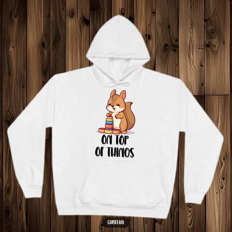 Funny Kawaii squirrel hoodie showing a determined character stacking small colorful wooden rings, ideal for a humorous present.